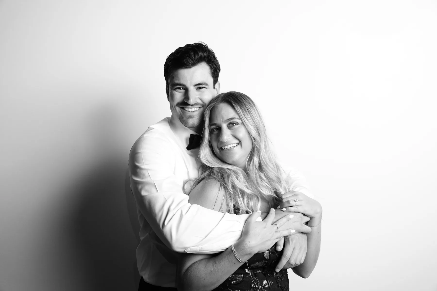 A couple embracing for a relaxed black-and-white portrait