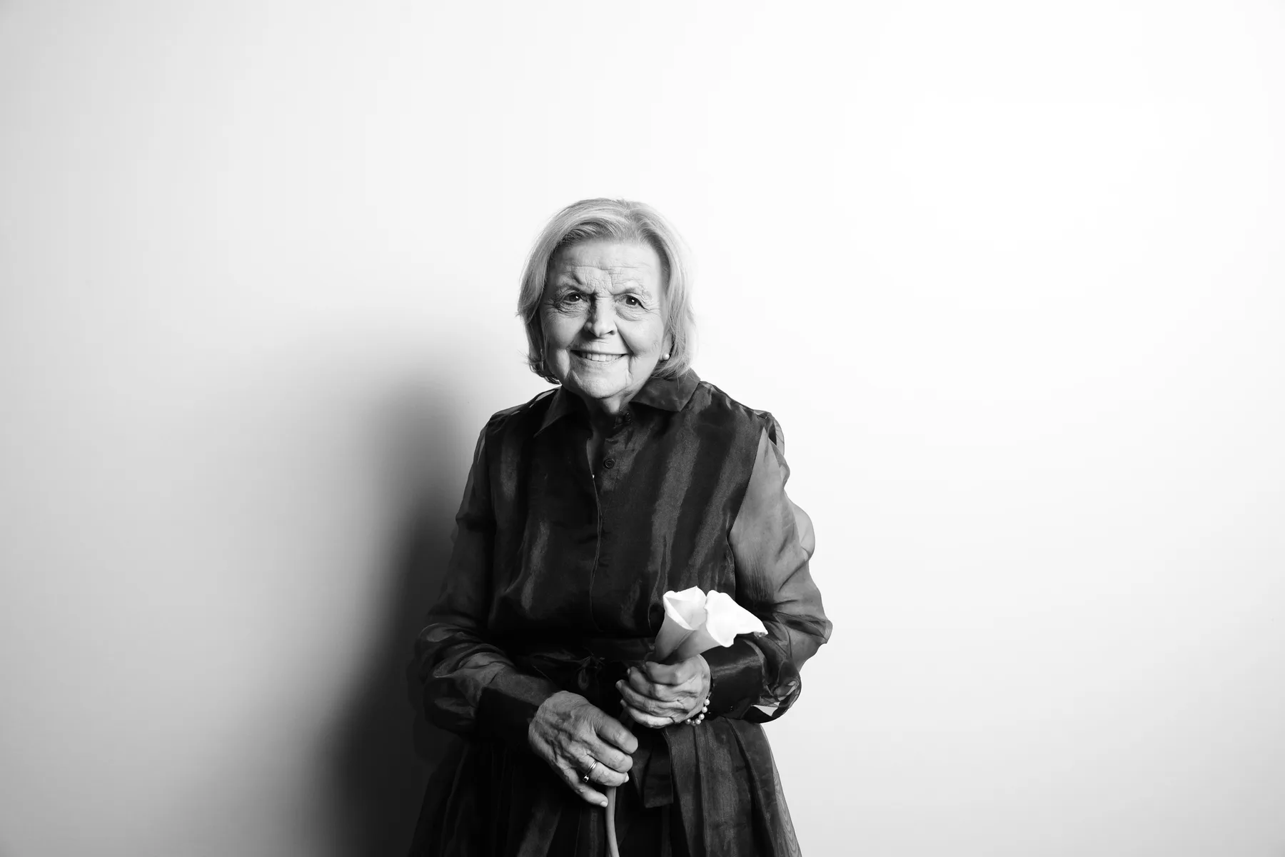 A wedding guest photographed in an elegant solo portrait