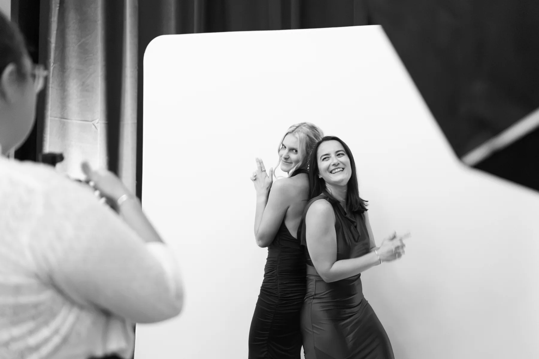 A POSER photographer directing two guests during The Cameo portrait experience