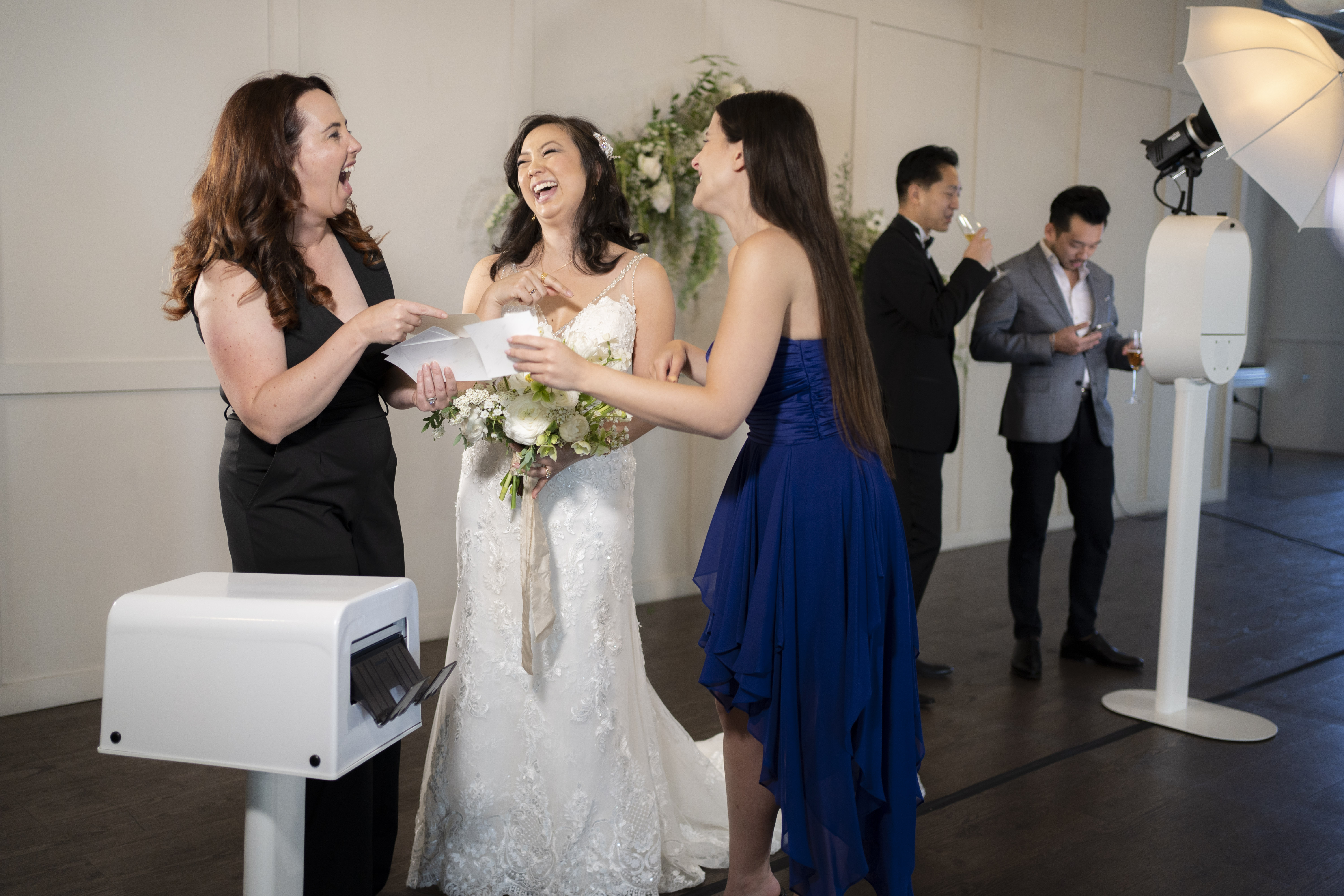 Bride laughing at her prints